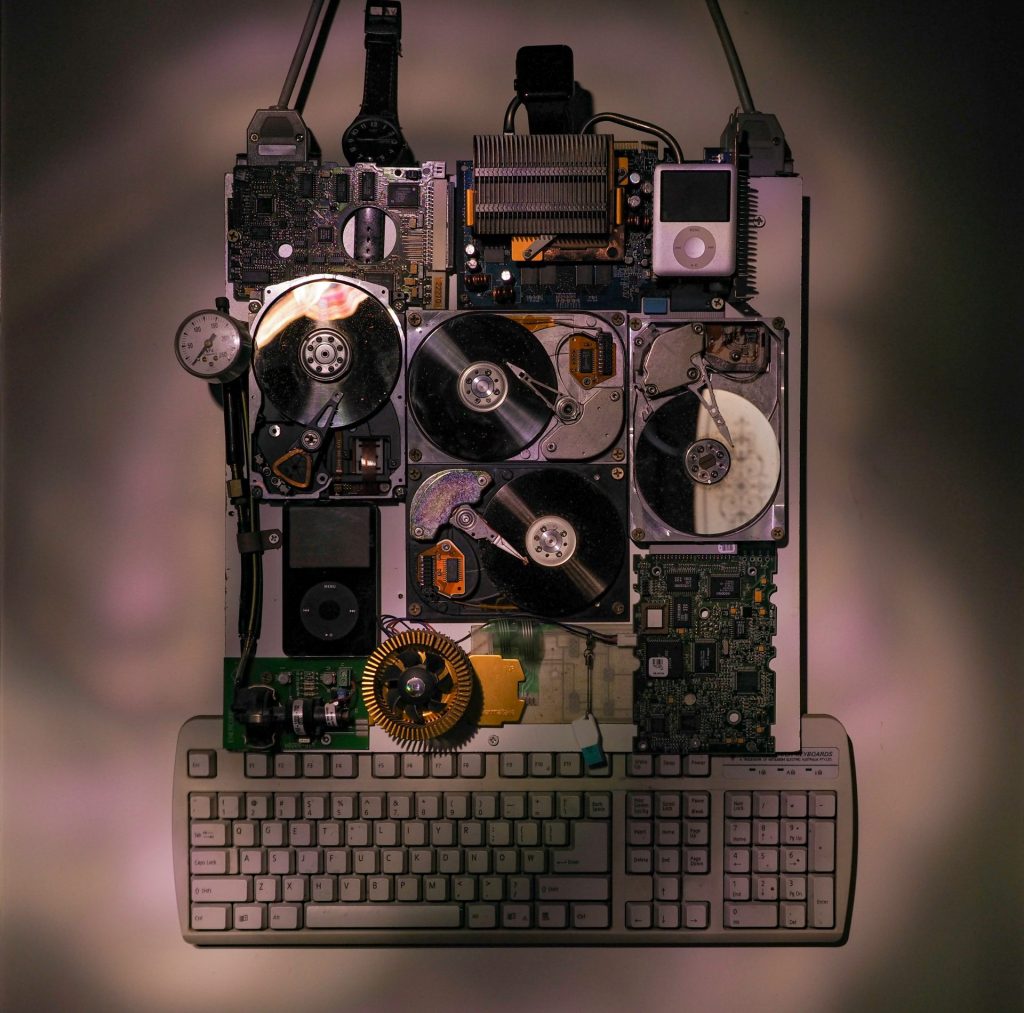 a computer keyboard with multiple parts attached to it